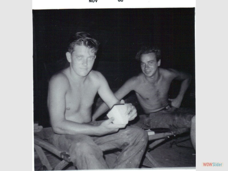 29. Sam, Norm looking at slides Camp Evans